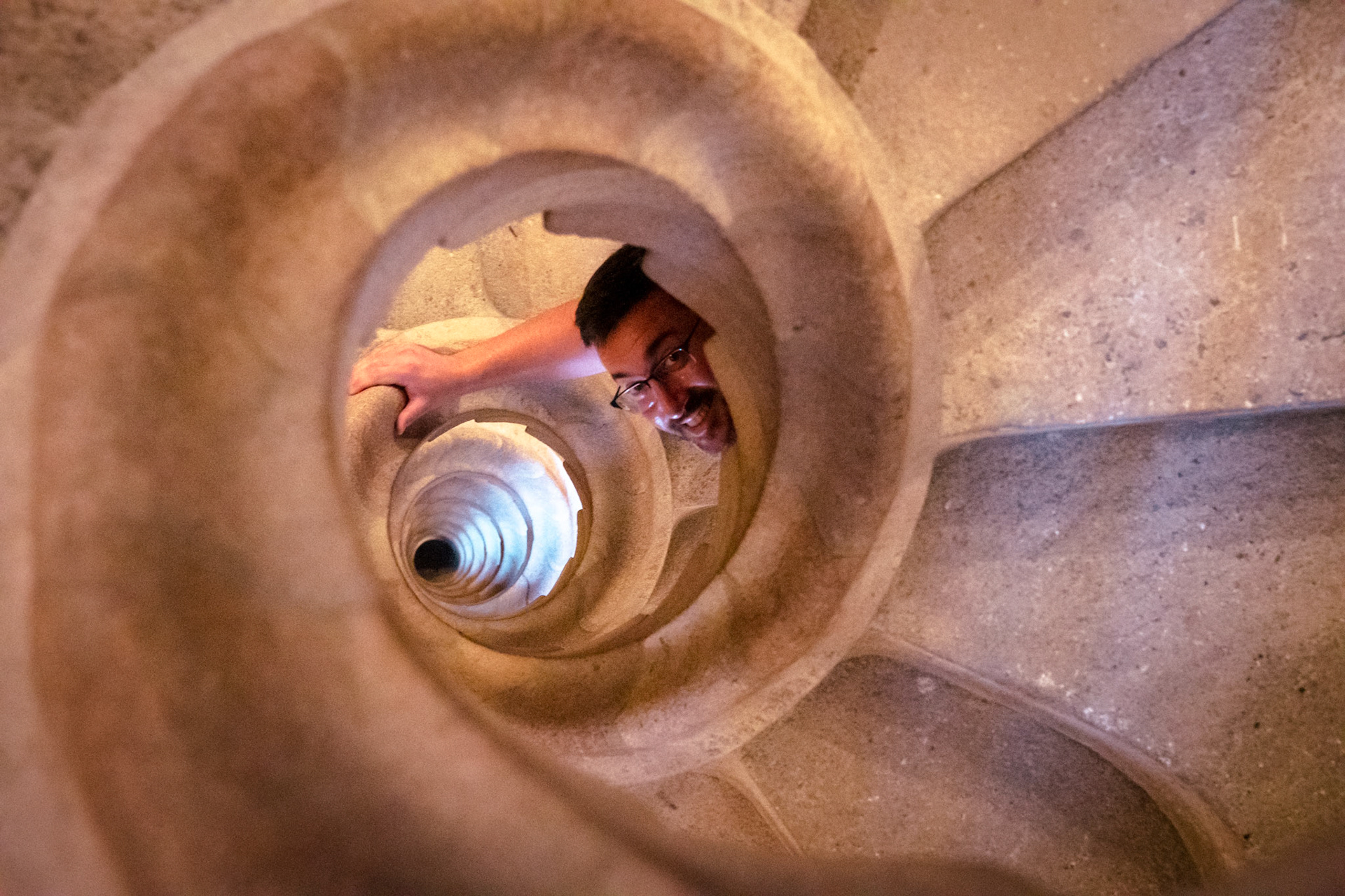 Looking down the sprial staircase of the Nativity Tower at The ceiling of La Sagrada Família