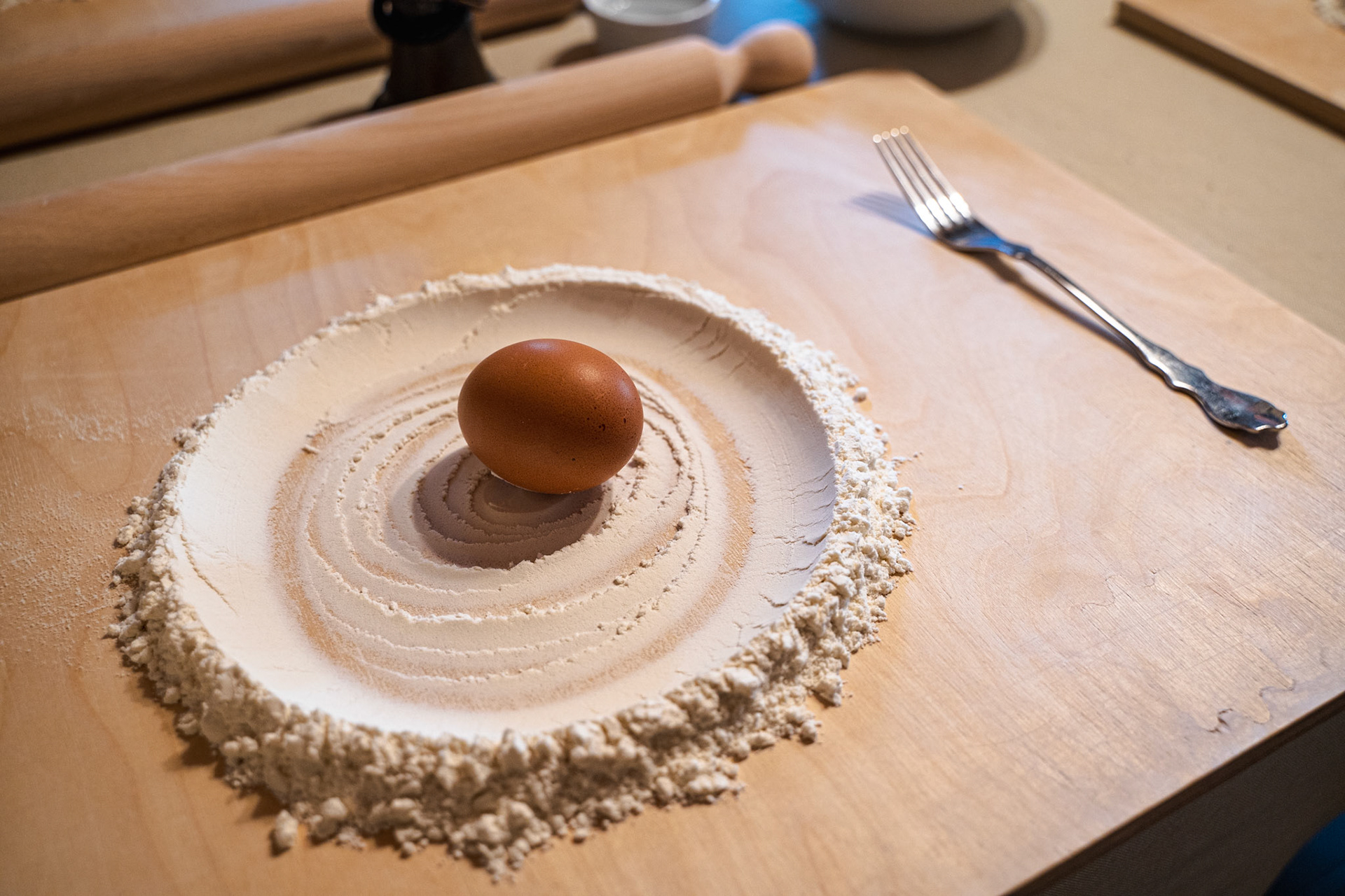 Preparing the flour to make the pasta dough