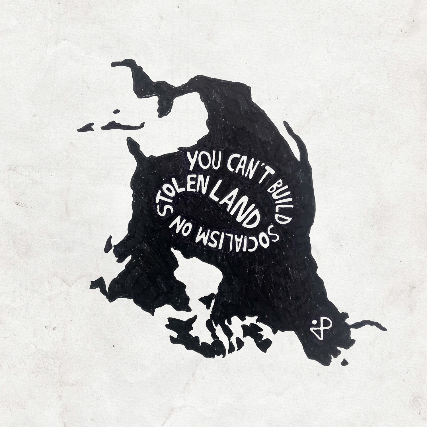 "You Can't Build Socialism on Stolen Land" quote on a reoriented map of Turtle Island / North America
