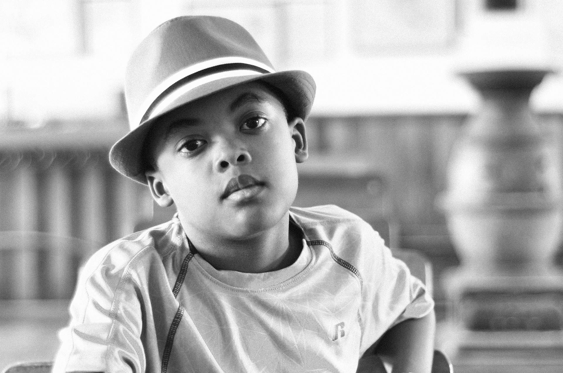 An African American male youth looks at the camera.