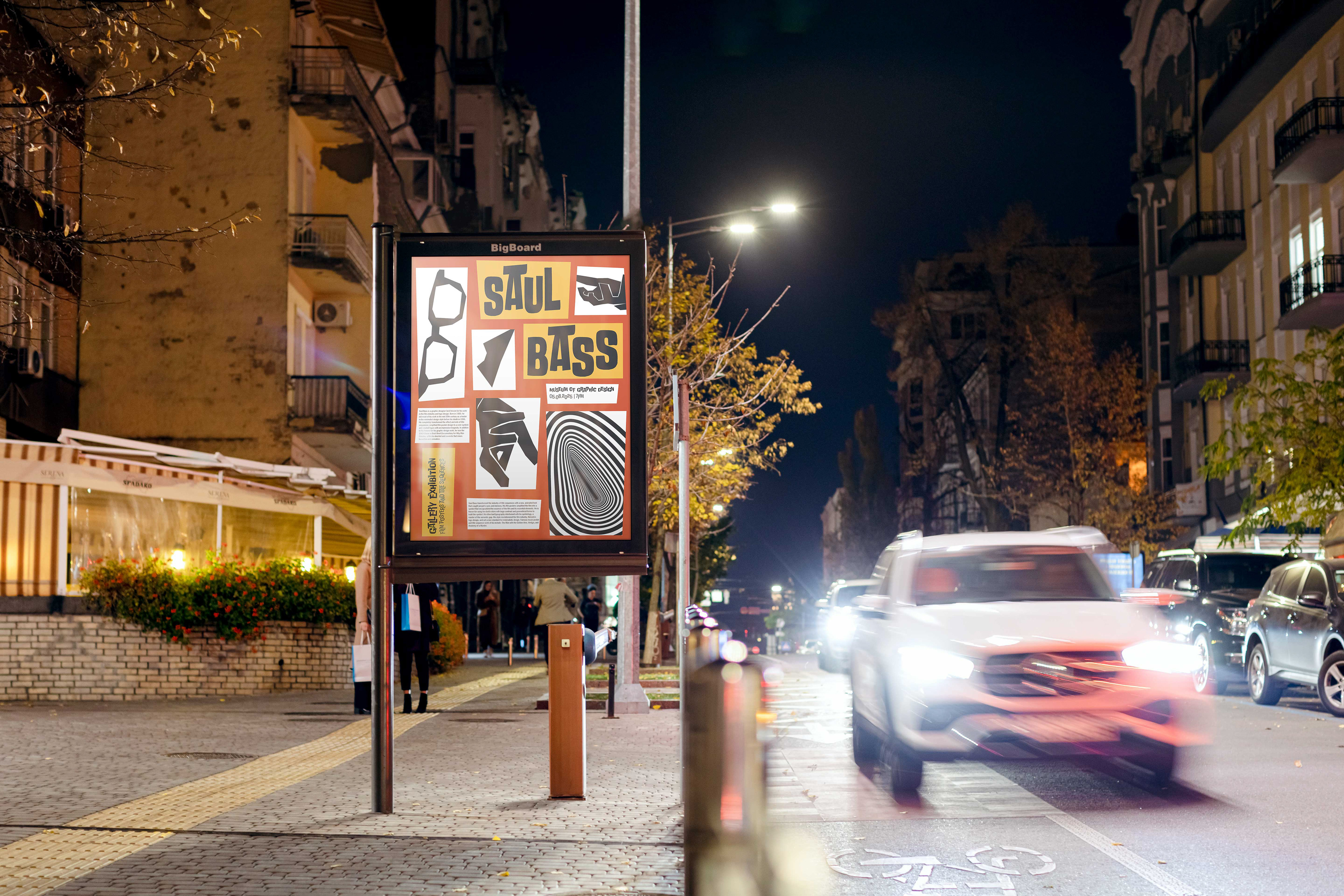 Mockup of a city street at night with the final poster design in an illuminated display