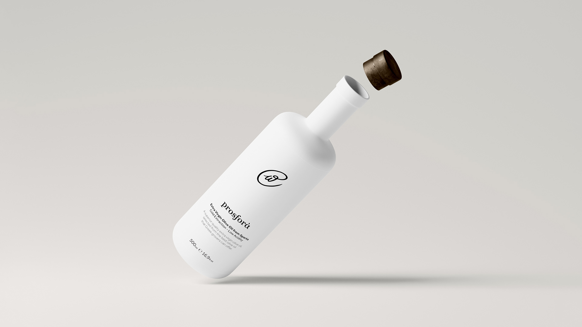 Prosfora olive oil white bottle floating in the air with its brown cork opening. The bottle features the prosfora logotype that resembles an olive at its center, while typography is in the bottom part of the bottle.