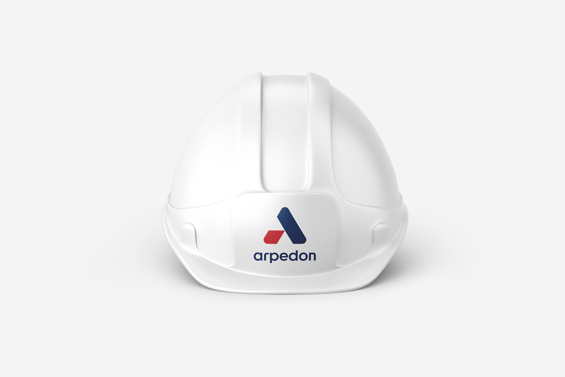 A hardhat with the logotype of Arpedon, an engineering industry 4.0 company in Greece.