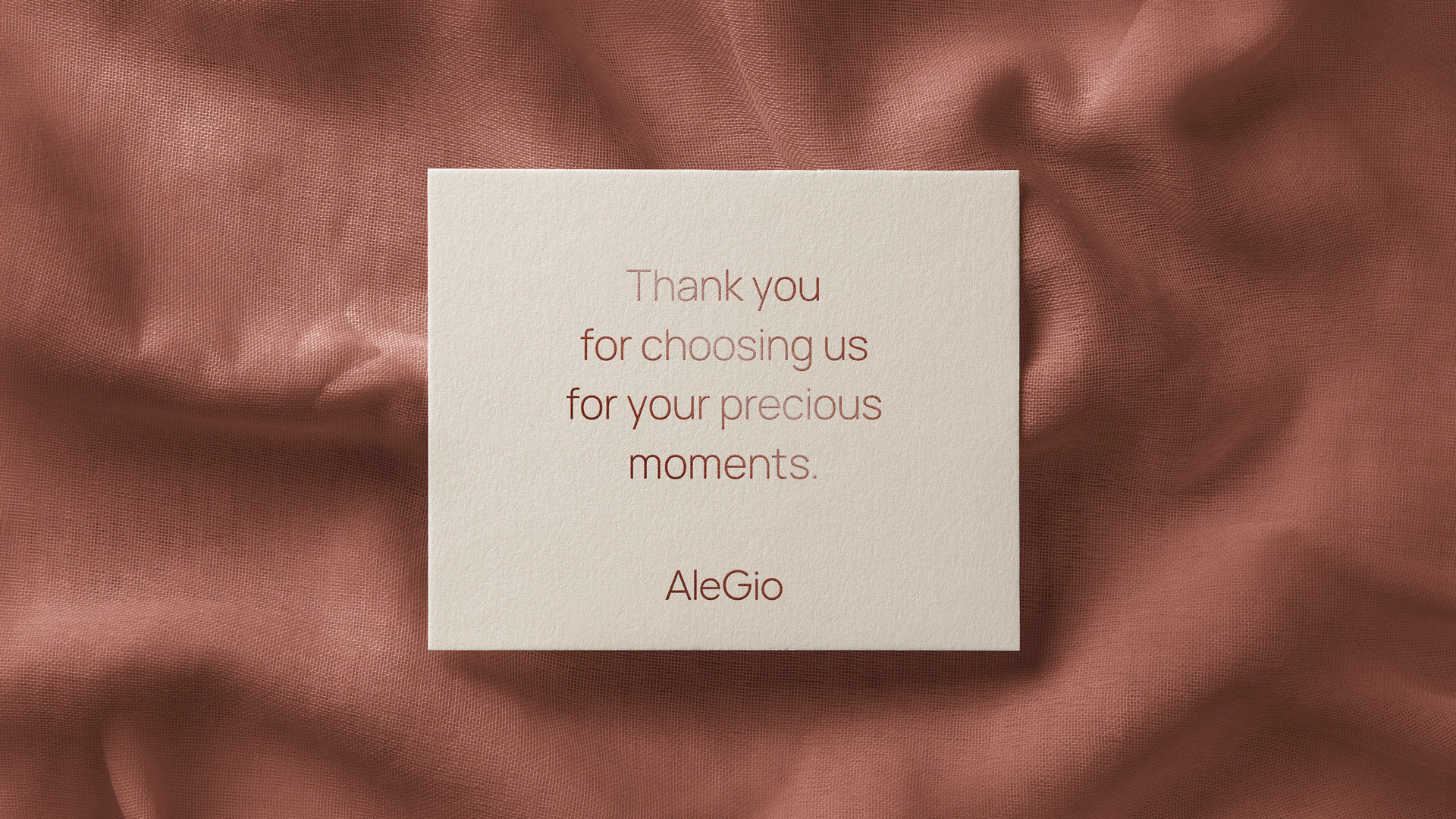 AleGio silver jewelry thank you slip to be placed in customer's bags. The typography and logo are in bronze foil and the paper is beige.