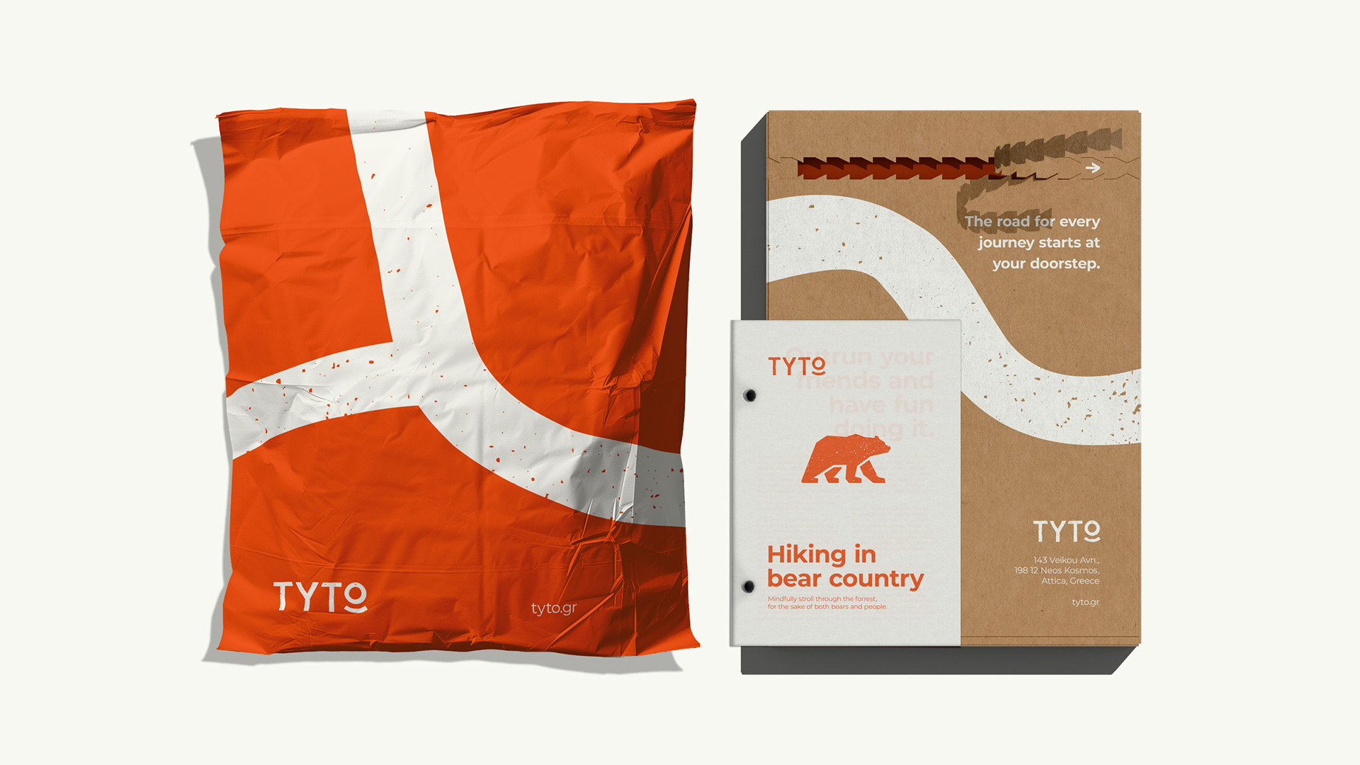 A mail bag, box and booklet, all in the brand colors and identity of TYTO hiking. The bag is orange with two warm white lines passing through it and features the TYTO logotype and website on it. The box is made of brown recycled paper, it is perforated in order to be opened. An arrow is printed in warm white to indicate the way to open the box. A warm white line also passes through the box and the TYTO logotype is printed in warm white in the bottom left, along with contact details and at the top left it writes a quote.