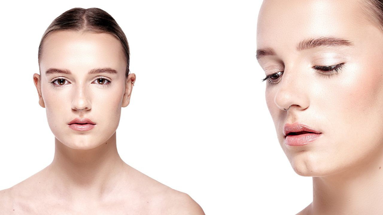 Commercial studio beauty photograph of a female model highlighting with flawless, glowing skin and professional clean look makeup application, perfect for skincare branding