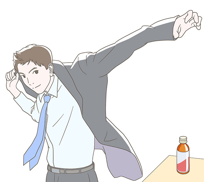 スーツに袖を通す男性