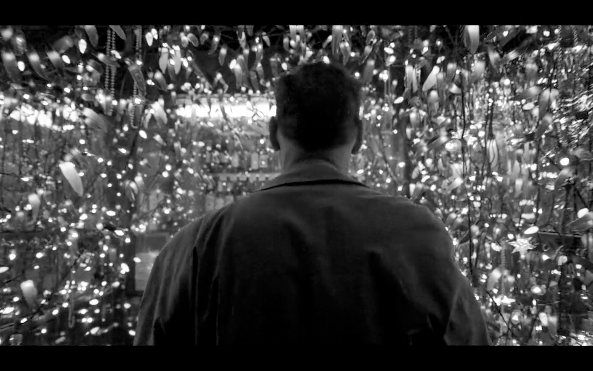 Screenshot taken from the movie birdman. The actor is entering in a store.