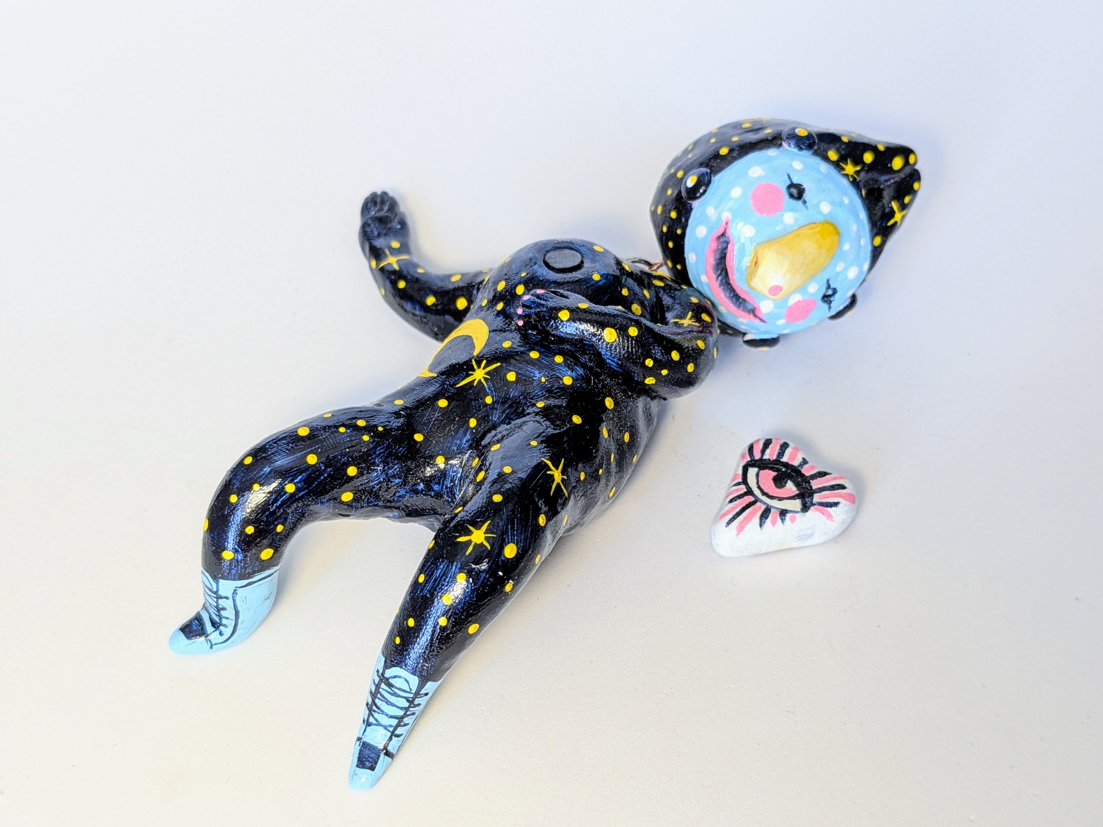 "Stargazer", 2024. 4x7x2", polymer clay, acrylic paint.