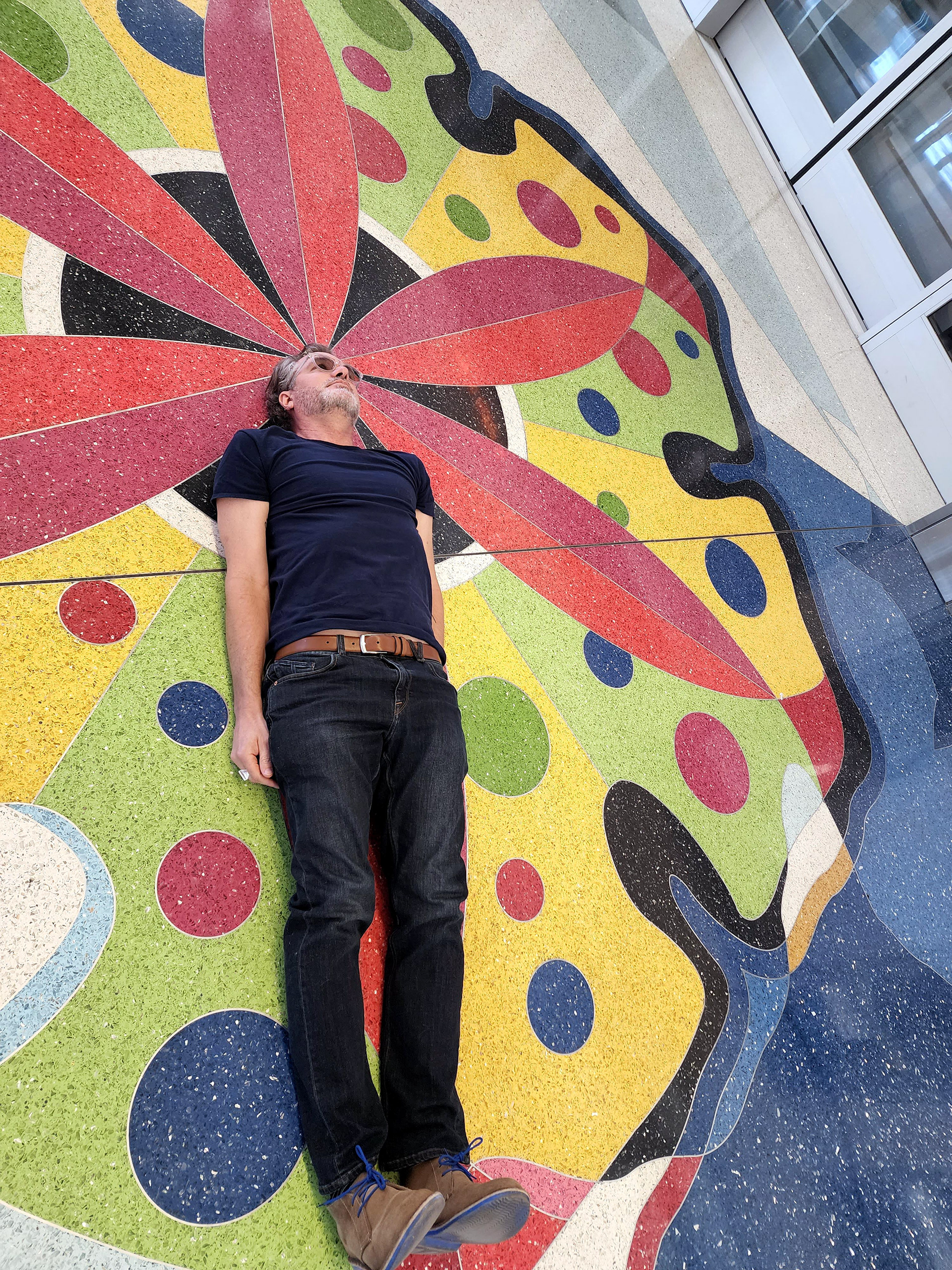 Me waiting for my terrazzo floor to debut at the Rental Car Return Station at Sky Harbor Airport in 2022