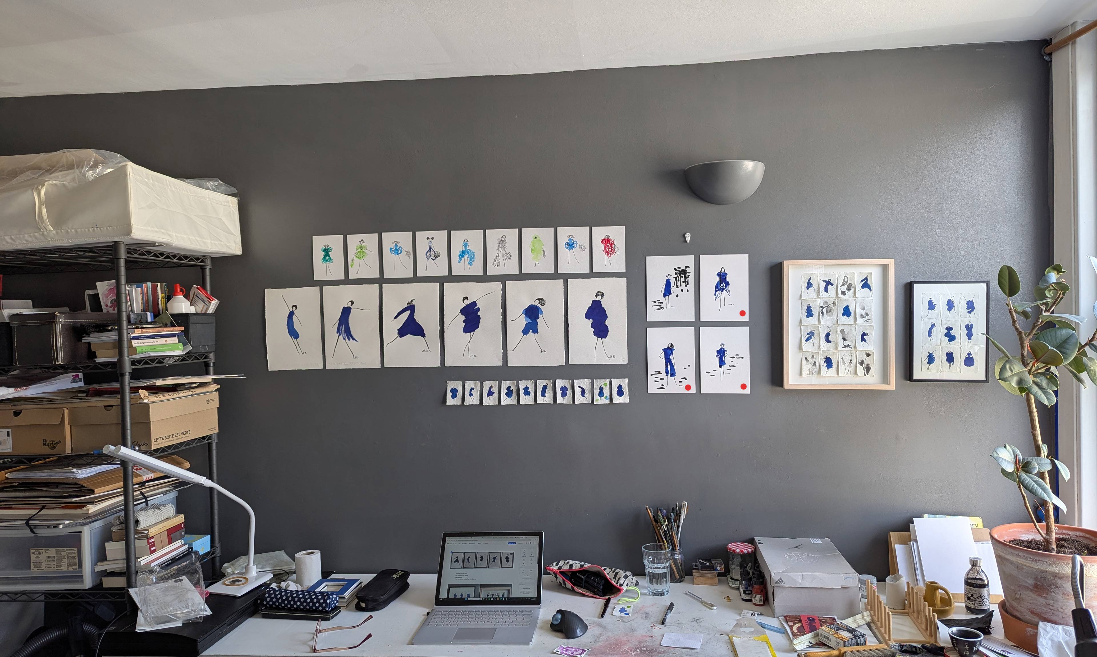 An artist studio at home showing the Top Flat Gallery exhibition space with ink drawings by Elena Blanco